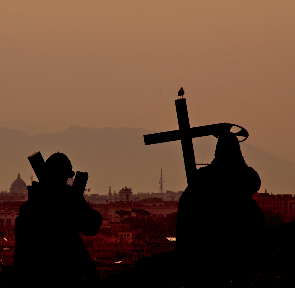 Cross overlooking city